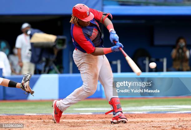 Outfielder Johan Mieses of Team Dominican Republic hits a two-run home run in the eighth inning against Team Republic of Korea during the bronze...