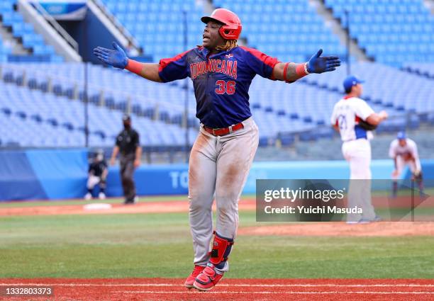 Outfielder Johan Mieses of Team Dominican Republic celebrates a two-run home run in the eighth inning against Team Republic of Korea during the...