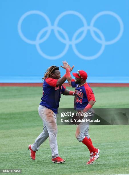 Outfielder Johan Mieses and Outfielder Emilio Bonifacio of Team Dominican Republic celebrate winning the bronze after their 10-6 during the bronze...