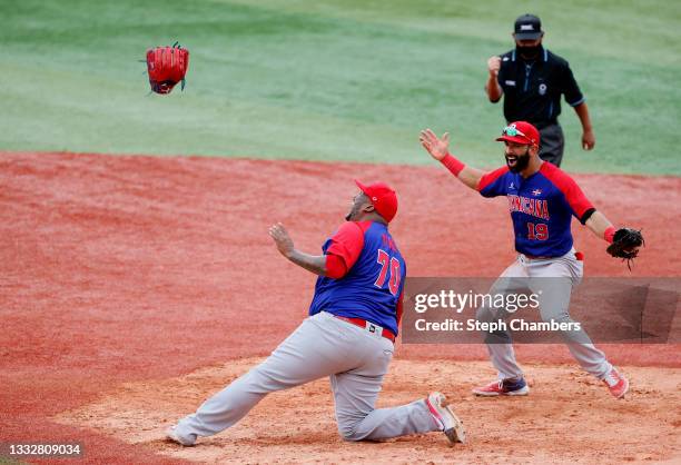 Pitcher Jose Diaz and infielder Jose Bautista of Team Dominican Republic celebrate winning the bronze after their 10-6 victory in the bronze medal...