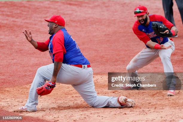 Pitcher Jose Diaz and infielder Jose Bautista of Team Dominican Republic celebrate winning the bronze after their 10-6 victory in the bronze medal...