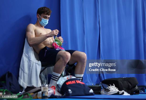 Thomas Daley of Team Great Britain is seen knitting before the Men's 10m Platform Final on day fifteen of the Tokyo 2020 Olympic Games at Tokyo...