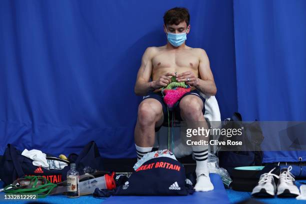 Thomas Daley of Team Great Britain is seen knitting before the Men's 10m Platform Final on day fifteen of the Tokyo 2020 Olympic Games at Tokyo...