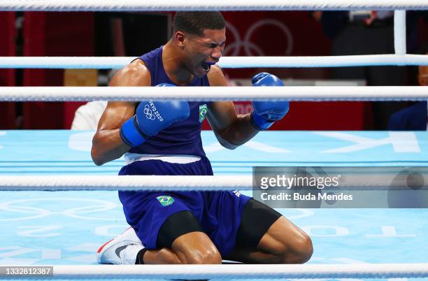 Herbert Sousa of Team Brazil celebrates victory and winning a gold medal during the Men's Middle Final bout between Oleksandr Khyzhniak of Team...