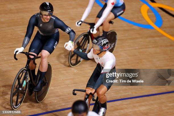 Callum Saunders of New Zealand commends to Yuta Wakimoto of Team Japan celebrates winning during the Men's Keirin first round, heat 5 of the track...