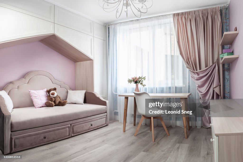 Part of the bedroom interior for a girl in pink tones in a modern romantic style close up