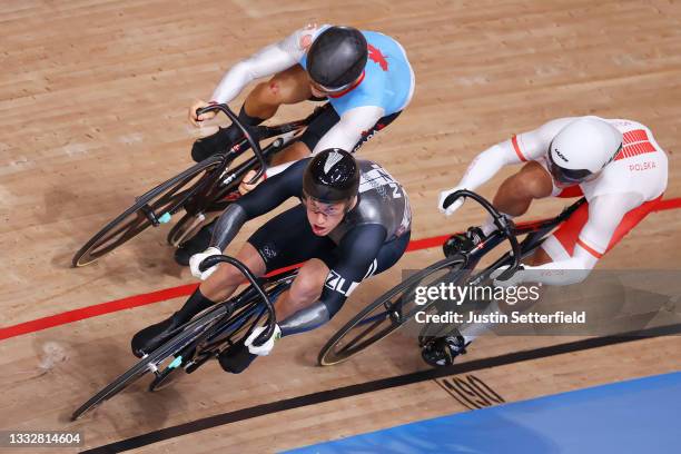 Hugo Barrette of Team Canada, Sam Webster of Team New Zealand and Patryk Rajkowski of Team Poland sprint during the Men's Keirin first round, heat of...