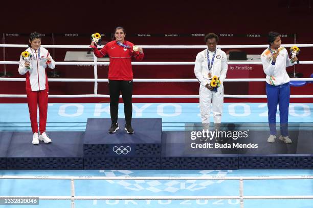 Silver medalist Hong Gu of Team China, gold medalist Busenaz Surmeneli of Team Turkey, bronze medalists Oshae Jones of Team United States and Lovlina...