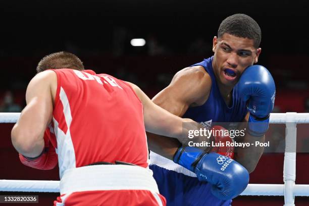 Herbert Sousa of Team Brazil punches Oleksandr Khyzhniak of Team Ukraine during the Men's Middle Final bout between Oleksandr Khyzhniak of Team...