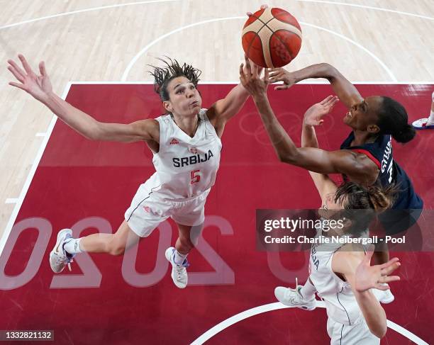 Sonja Vasic of Team Serbia and teammate Tina Krajisnik compete for possession of the ball with Sandrine Gruda of Team France during the second half...