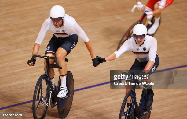 Roger Kluge and Theo Reinhardt of Team Germany sprint during the Men's Madison final of the track cycling on day filthen of the Tokyo 2020 Olympic...