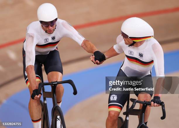 Roger Kluge and Theo Reinhardt of Team Germany compete during the Men's Madison final of the track cycling on day filthen of the Tokyo 2020 Olympic...
