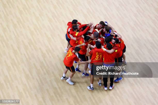 Team Spain celebrate winning after the final whistle of the Men's Bronze Medal handball match between Egypt and Spain on day fifteen of the Tokyo...