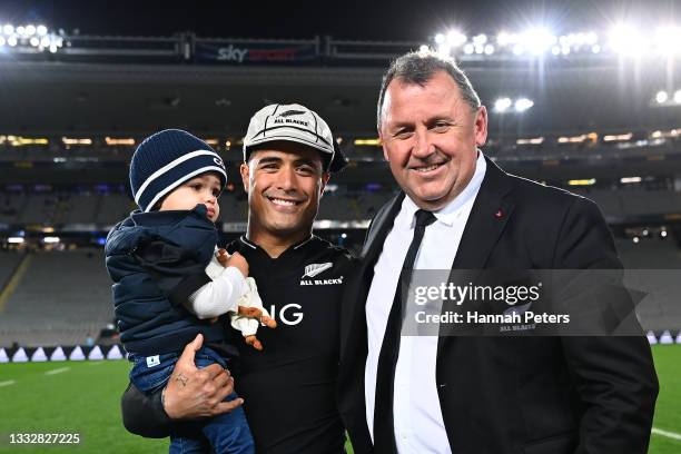 Aaron Smith of the All Blacks poses with photos with his son Luka and All Blacks head coach Ian Foster after his 100th test during the Rugby...