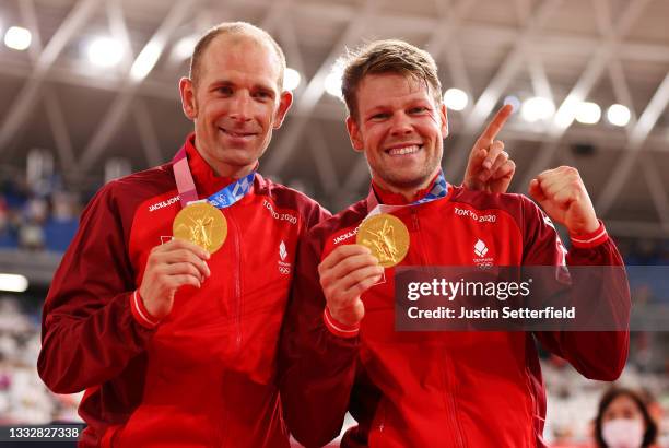 Gold medalists Michael Morkov and Lasse Norman Hansen of Denmark, pose on the podium during the medal ceremony after the Men's Madison final of the...