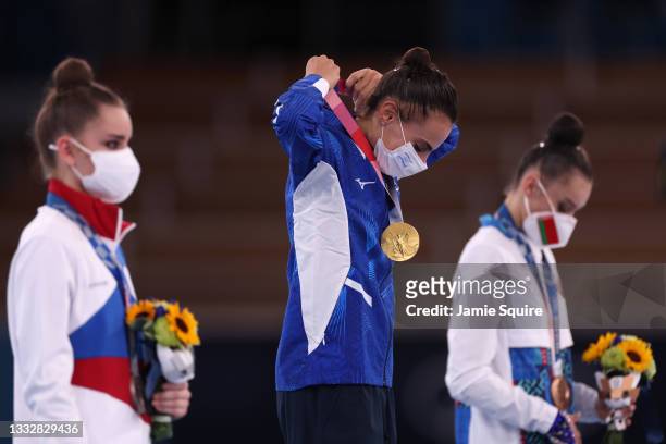 Linoy Ashram of Team Israel accepts the gold medal on the podium after the Individual All-Around Final on day fifteen of the Tokyo 2020 Olympic Games...