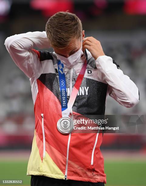 Silver medalist Jonathan Hilbert of Team Germany stands on the podium during the medal ceremony for the Men’s 50km walk on day fifteen of the Tokyo...