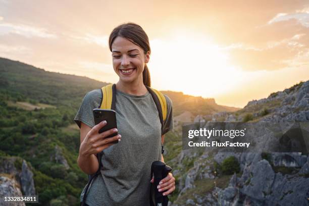 gps mobile app, just said that i arrived at the top of the mountain - people hiking stock pictures, royalty-free photos & images