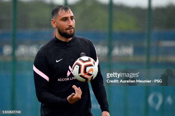 Gianluigi Donnarumma looks on during a Paris Saint-Germain training session at Ooredoo center on August 07, 2021 in Paris, France.