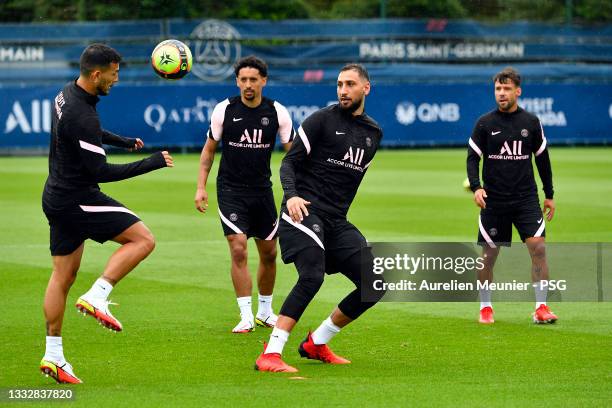 Gianluigi Donnarumma warms up during a Paris Saint-Germain training session at Ooredoo center on August 07, 2021 in Paris, France.