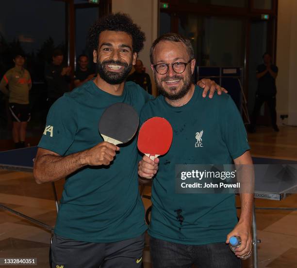 Mohamed Salah of Liverpool with Matt McCann of Liverpool winners of the Table Tennis Tournament at Their Pre-Season Training Camp on August 06, 2021...