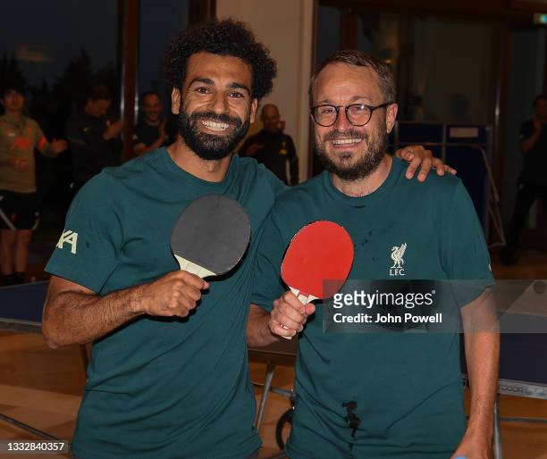 Mohamed Salah of Liverpool with Matt McCann of Liverpool winners of the Table Tennis Tournament at Their Pre-Season Training Camp on August 06, 2021...