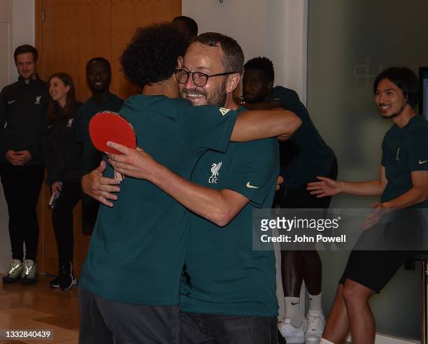 Mohamed Salah of Liverpool with Matt McCann of Liverpool winners of the during a Table Tennis Tournament at Their Pre-Season Training Camp on August...