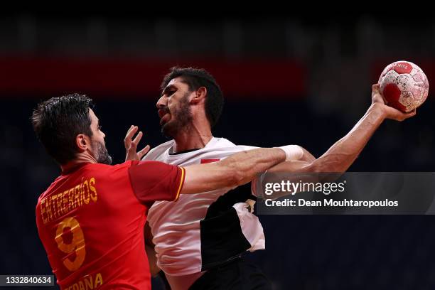 Yahia Omar of Team Egypt looks to shoot at goal while being challenged by Raul Entrerrios Rodriguez of Team Spain during the Men's Bronze Medal...