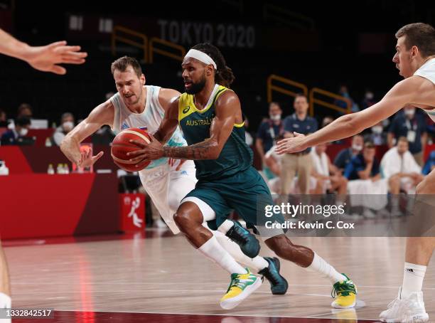 Patty Mills of Team Australia drives to the basket against Team Slovenia during the first half of the Men's Basketball Bronze medal game on day...