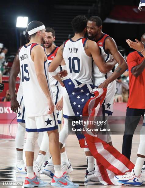 Team United States celebrate the victory over Team France after the Men's Basketball Finals game between Team United States and Team France on day...