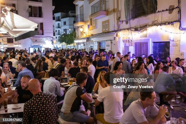 Tourists have fun in pubs in the port, one of the areas where more crowds of people are due to the lack of nightlife on the island on August 7, 2021...