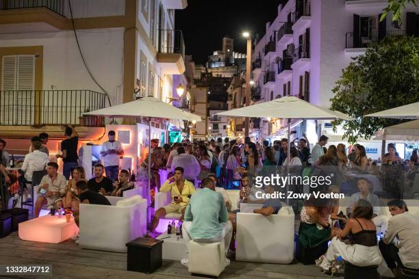 Tourists have fun in pubs in the port, one of the areas where more crowds of people are due to the lack of nightlife on the island on August 7, 2021...