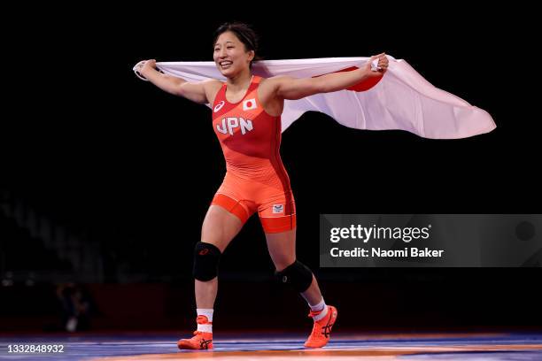 Yui Susaki of Team Japan celebrates victory over Yanan Sun of Team China during the Women's 50kg Final on day fifteen of the Tokyo 2020 Olympic Games...