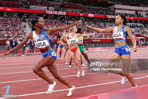 Allyson Felix of Team United States passes the baton to teammate Dalilah Muhammad in the Women' s 4 x 400m Relay Final on day fifteen of the Tokyo...