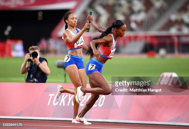 Allyson Felix of Team United States passes the baton to teammate Dalilah Muhammad in the Women' s 4 x 400m Relay Final on day fifteen of the Tokyo...