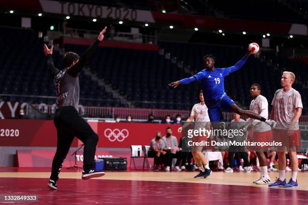 Luc Abalo of Team France shoots at goal as Niklas Landin of Team Denmark looks to save during the Men's Gold Medal handball match between France and...
