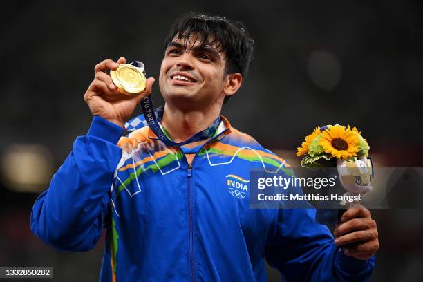 Gold medalist Neeraj Chopra of Team India stands on the podium during the medals ceremony for the Men's Javelin Throw on day fifteen of the Tokyo...