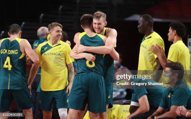 Jock Landale of Team Australia hugs teammate Matthew Dellavedova of Team Australia while celebrating their victory over Team Slovenia in the Men's...