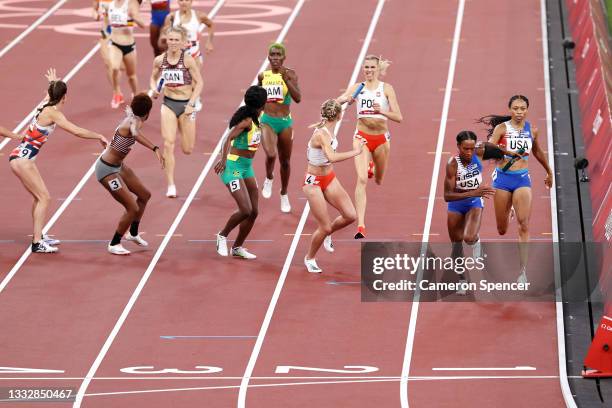 Allyson Felix of Team United States passes the baton to teammate Dalilah Muhammad in the Women' s 4 x 400m Relay Final on day fifteen of the Tokyo...