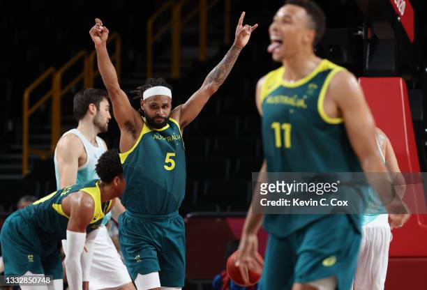 Patty Mills of Team Australia and teammate Dante Exum celebrate their win over Slovenia in the Men's Basketball Bronze medal game on day fifteen of...