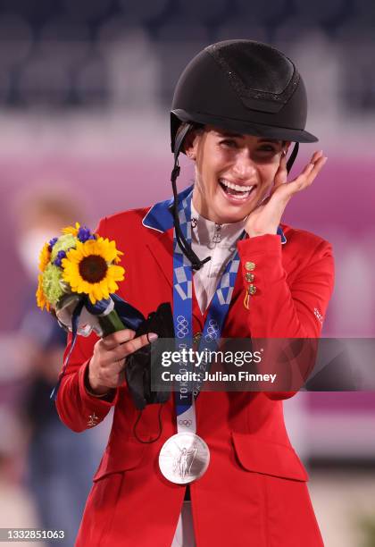 Silver medalist Jessica Springsteen of Team United States celebrates on the podium during the Jumping Team Final medal ceremony at Equestrian Park on...