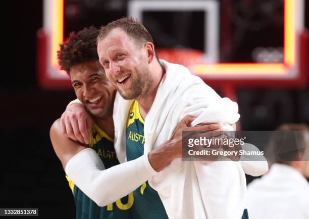 Joe Ingles of Team Australia and teammate Matisse Thybulle of Team Australia celebrate their win over Team Slovenia in the Men's Basketball Bronze...