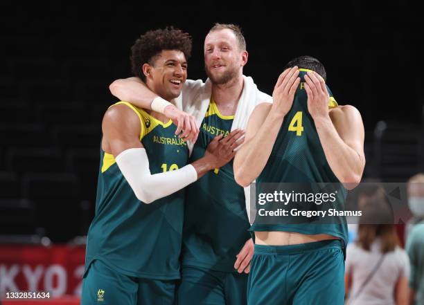 Matisse Thybulle, Joe Ingles and Chris Goulding of Team Australia celebrate a win over Slovenia in the Men's Basketball Bronze medal game on day...