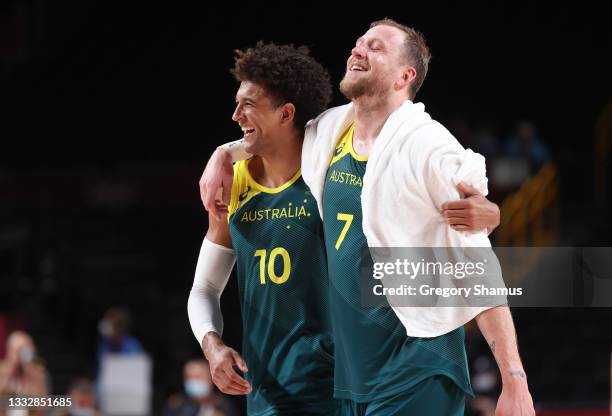 Matisse Thybulle and Joe Ingles of Team Australia celebrate a win over Slovenia in the Men's Basketball Bronze medal game on day fifteen of the Tokyo...