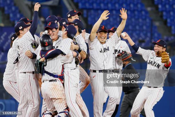 Players of Team Japan celebrate winning the gold after their 2-0 victory over Team United States in the gold medal game between Team United States...