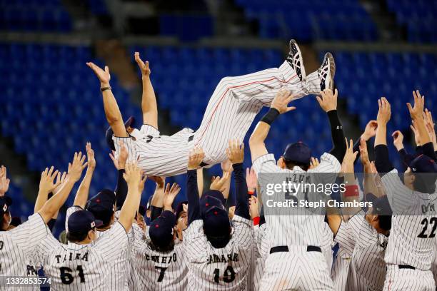 Head coach Atsunori Inaba of Team Japan is to winning the gold after their 2-0 victory over Team United States in the gold medal game between Team...