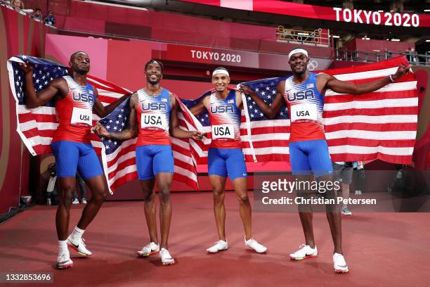 Bryce Deadmon, Michael Cherry, Michael Norman and Rai Benjamin of Team United States celebrate after winning the gold medal in the Men's 4 x 400m...