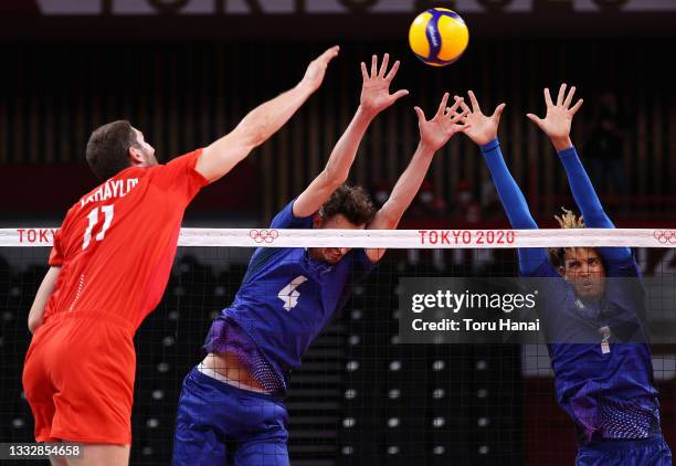 Barthelemy Chinenyeze and Jean Patry of Team France compete against Maxim Mikhaylov of Team ROC during the Men's Gold Medal Match on day fifteen of...