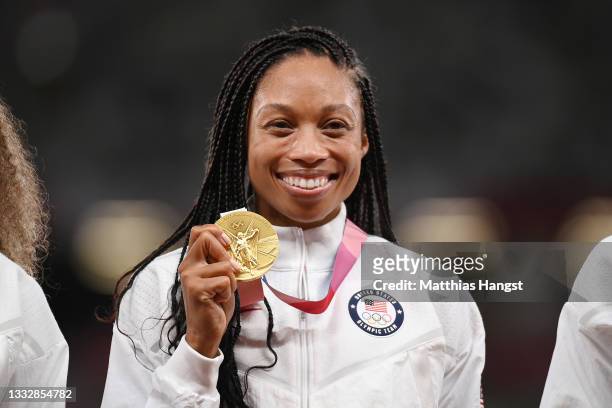 Gold medal winner Allyson Felix of Team United States stands on the podium during the medal ceremony for the Women's 4 x 400m Relay on day fifteen of...