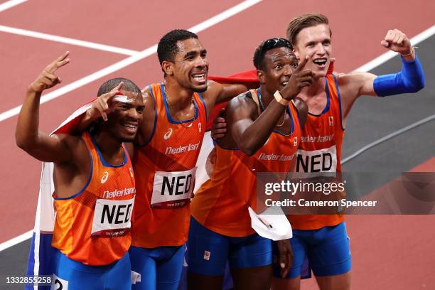 Ramsey Angela, Terrence Agard, Liemarvin Bonevacia and Tony van Diepen of Team Netherlands celebrate after winning the silver medal in the Men's 4 x...